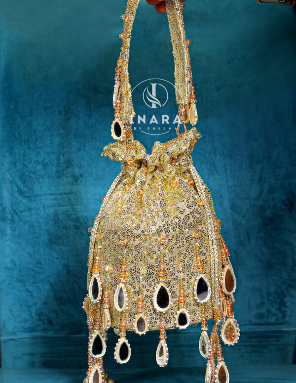Ruhi Mirror golden potli bag
